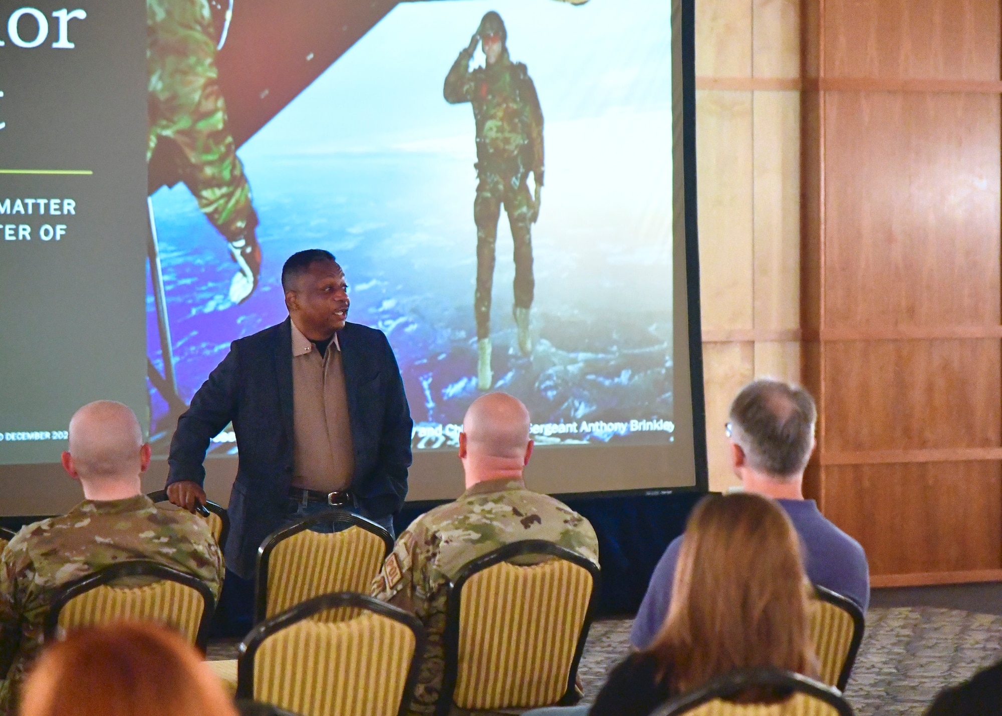 Retired Air Force Chief Master Sgt. Anthony Brinkley speaks to Team Hill personnel.