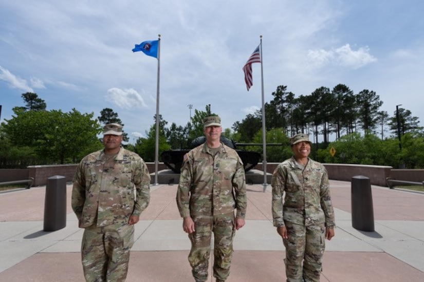 U.S. Army Central's Deputy Commanding General and two others from ARCENT pose as Arkansas State University alumni.