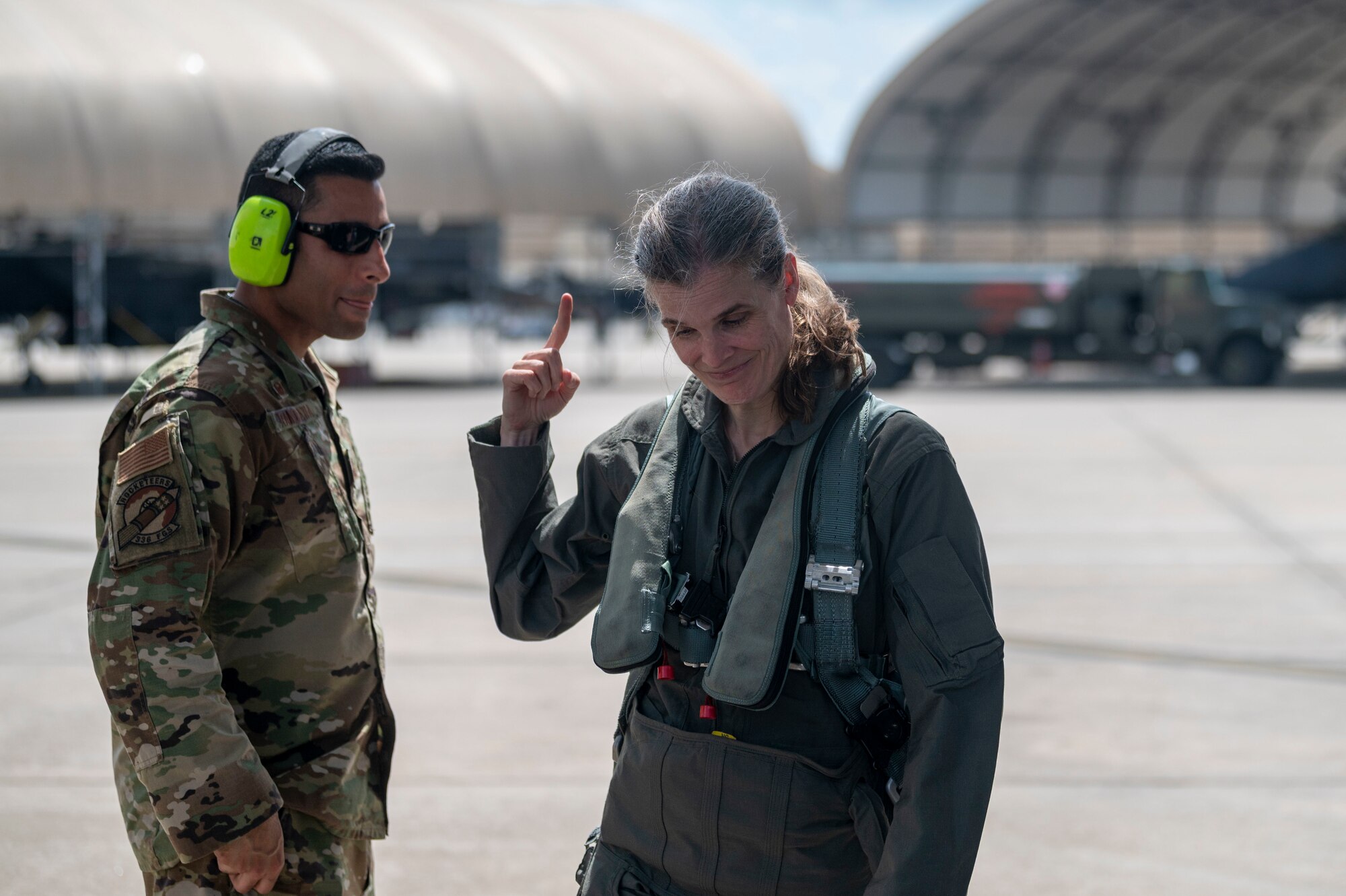 Col. Leah Fry, 4th Maintenance Group commander, talks to an Airman after her fini flight at Seymour Johnson Air Force Base, North Carolina, May 4, 2022. Fry is retiring from the U.S. Air Force after 26 years of service. (U.S. Air Force photo by Senior Airman Kevin Holloway)