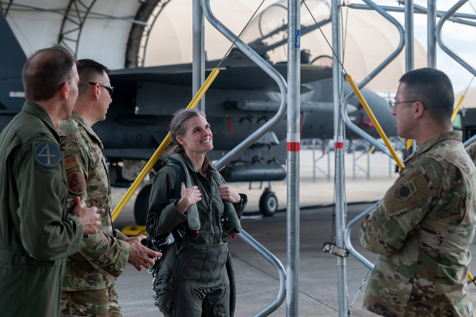 Col. Leah Fry, 4th Maintenance Group commander, talks to base leadership after her fini flight at Seymour Johnson Air Force Base, North Carolina, May 4, 2022. Fry has spent the last four years as the 4th MXG commander. (U.S. Air Force photo by Senior Airman Kevin Holloway)