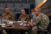 From the right, U.S. Navy Adm. Charles Richard, commander of the U.S. Strategic Command, meets with Col. Anita Feugate Opperman, 341st Missile Wing commander and Col. Daniel Voorhies, 341st MW vice commander May 6, 2022, during his trip to Malmstrom Air Force Base, Mont. During his visit, Richard recognized Airmen and got an in-person look at the nuclear deterrence mission. (U.S. Air Force photo by Airman 1st Class Elijah Van Zandt)