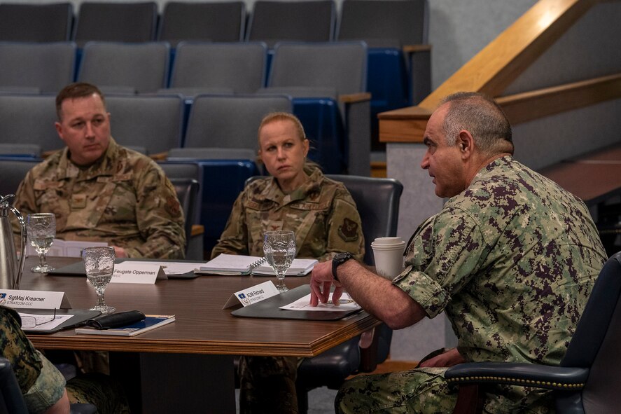 From the right, U.S. Navy Adm. Charles Richard, commander of the U.S. Strategic Command, meets with Col. Anita Feugate Opperman, 341st Missile Wing commander and Col. Daniel Voorhies, 341st MW vice commander May 6, 2022, during his trip to Malmstrom Air Force Base, Mont. During his visit, Richard recognized Airmen and got an in-person look at the nuclear deterrence mission. (U.S. Air Force photo by Airman 1st Class Elijah Van Zandt)