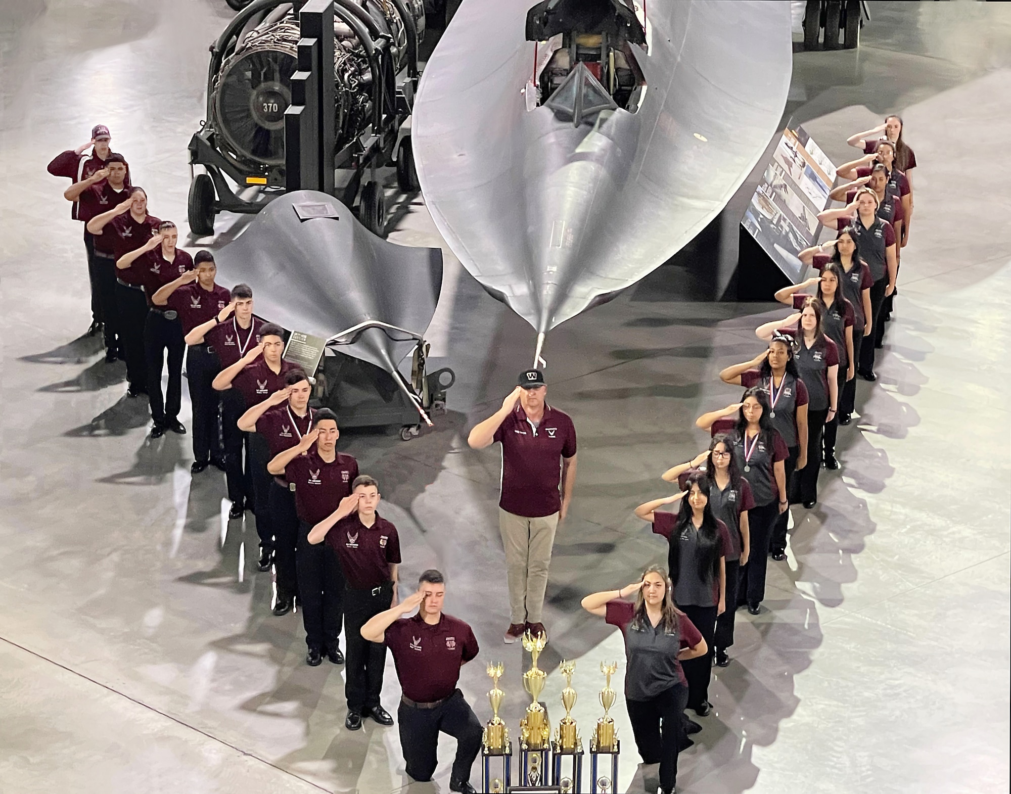 The Phantom Unarmed Drill and the Warhawk Armed Drill Teams of Waller High School Air Force Junior ROTC Unit TX-20065, Waller, Texas, proudly display their hard-earned trophies from the Air Force Nationals drill competition at the Air Force Museum, Wright-Patterson Air Force Base, Ohio, March 19, 2022.