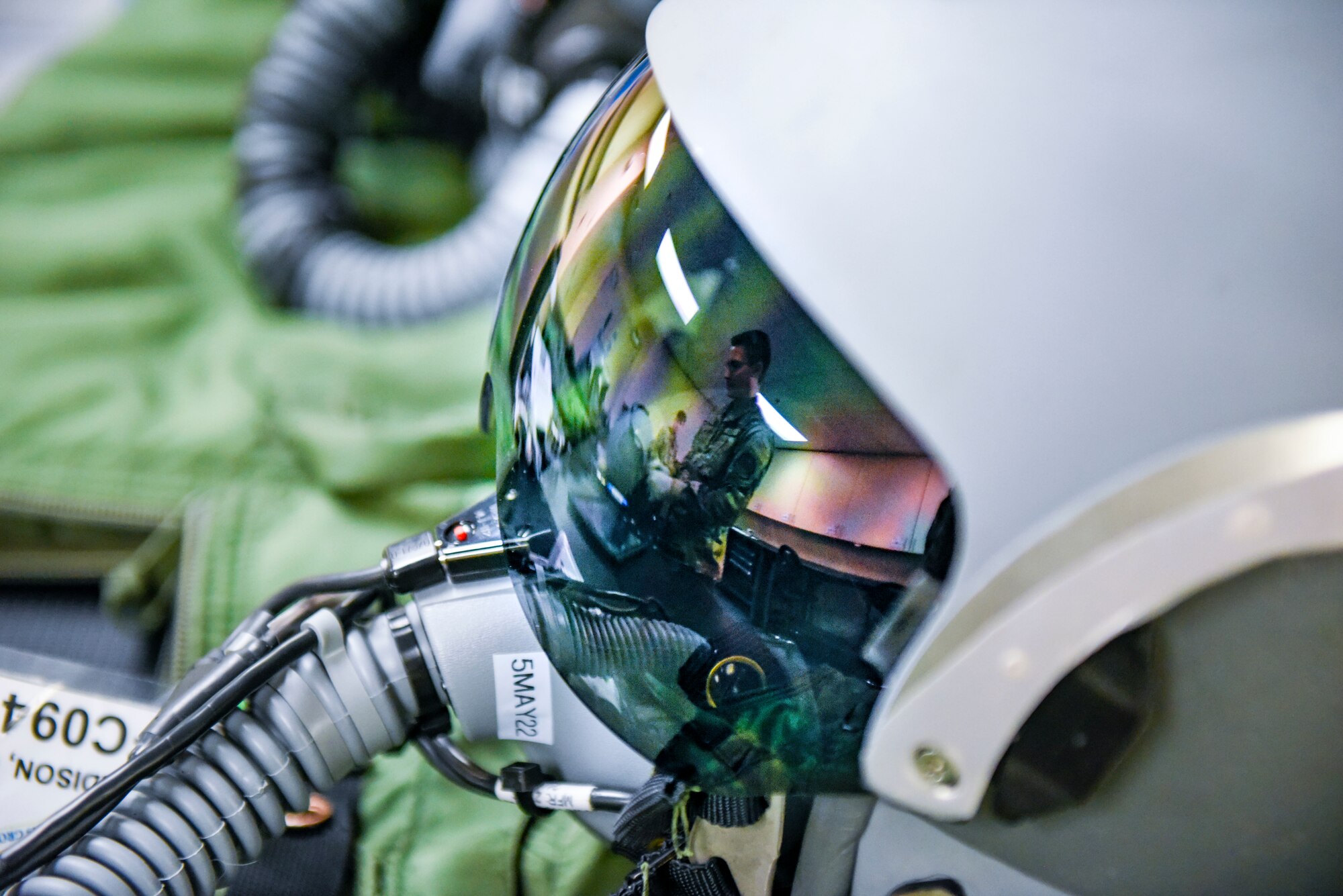 U.S. Air Force Airman 1st Class Payton Arbach, 92nd Operation Support Squadron Aircrew Flight Equipment apprentice, finishes putting a pilot’s helmet together at Fairchild Air Force Base, Washington, May 3, 2022. AFE’s job is to maintain the practicality and safety of equipment to prevent the rare occurrence of defective gear. (U.S. Air Force photo by Airman 1st Class Haiden Morris)