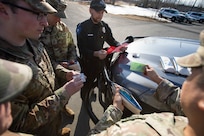 Alaska National Guardsmen Sgt. 1st Class Oliver Meza, noncommissioned officer in charge of Drug Demand Reduction, trains guardsmen and police officers in the use of naloxone kits provided through Project HOPE in Wasilla, Alaska, April 13, 2022. The Alaska National Guard collaborates with the Office of Substance Misuse and Addiction Prevention in Project HOPE, a state-run initiative aimed at providing opioid overdose rescue kits and training mission partners and law enforcement agencies. (Alaska National Guard photo by Victoria Granado)