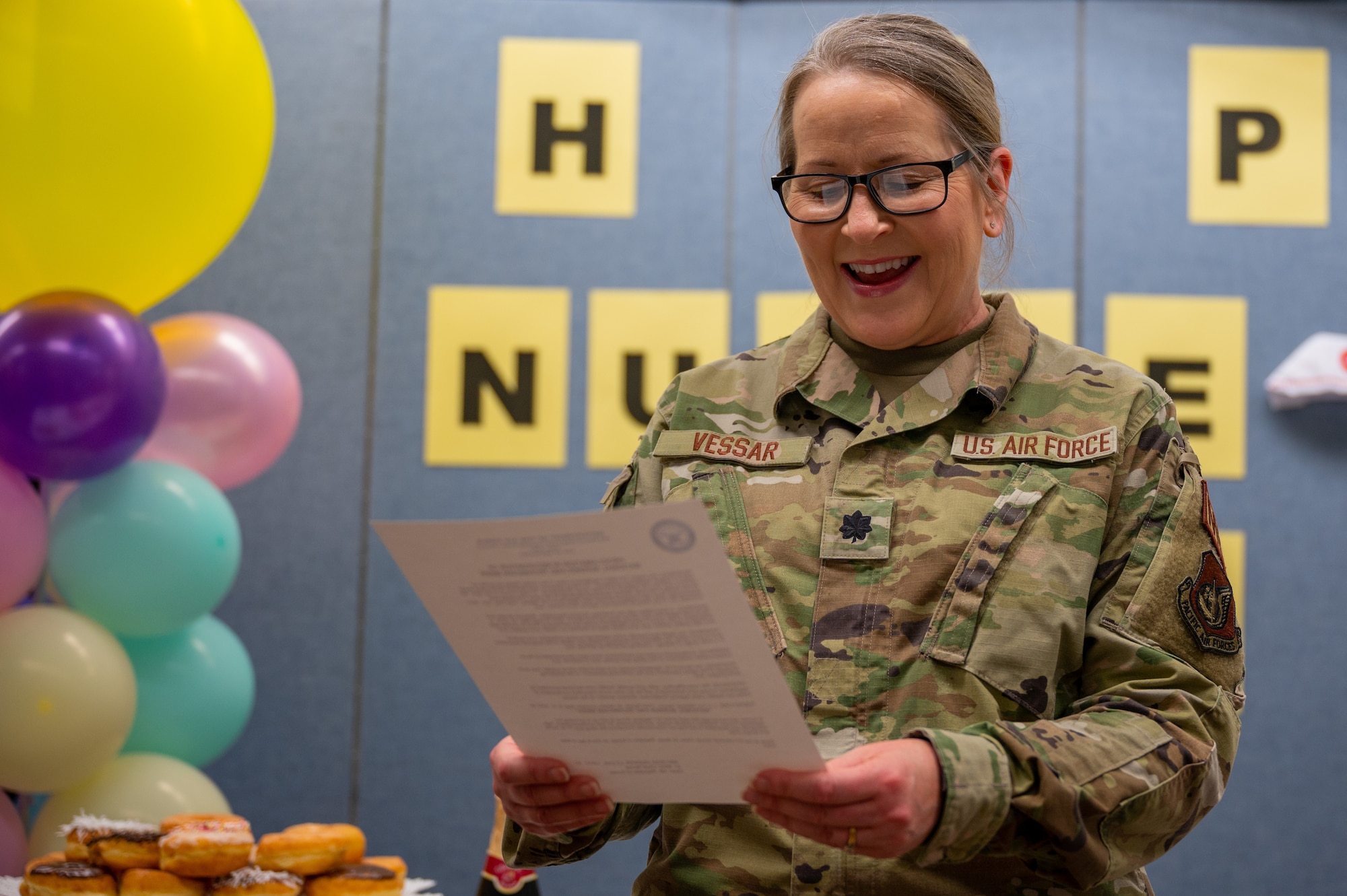 Lt. Col. Melissa Vessar, 51st Medical Group chief nurse, smiles while reading the proclamation memorandum in honor of National Nurses and Technician