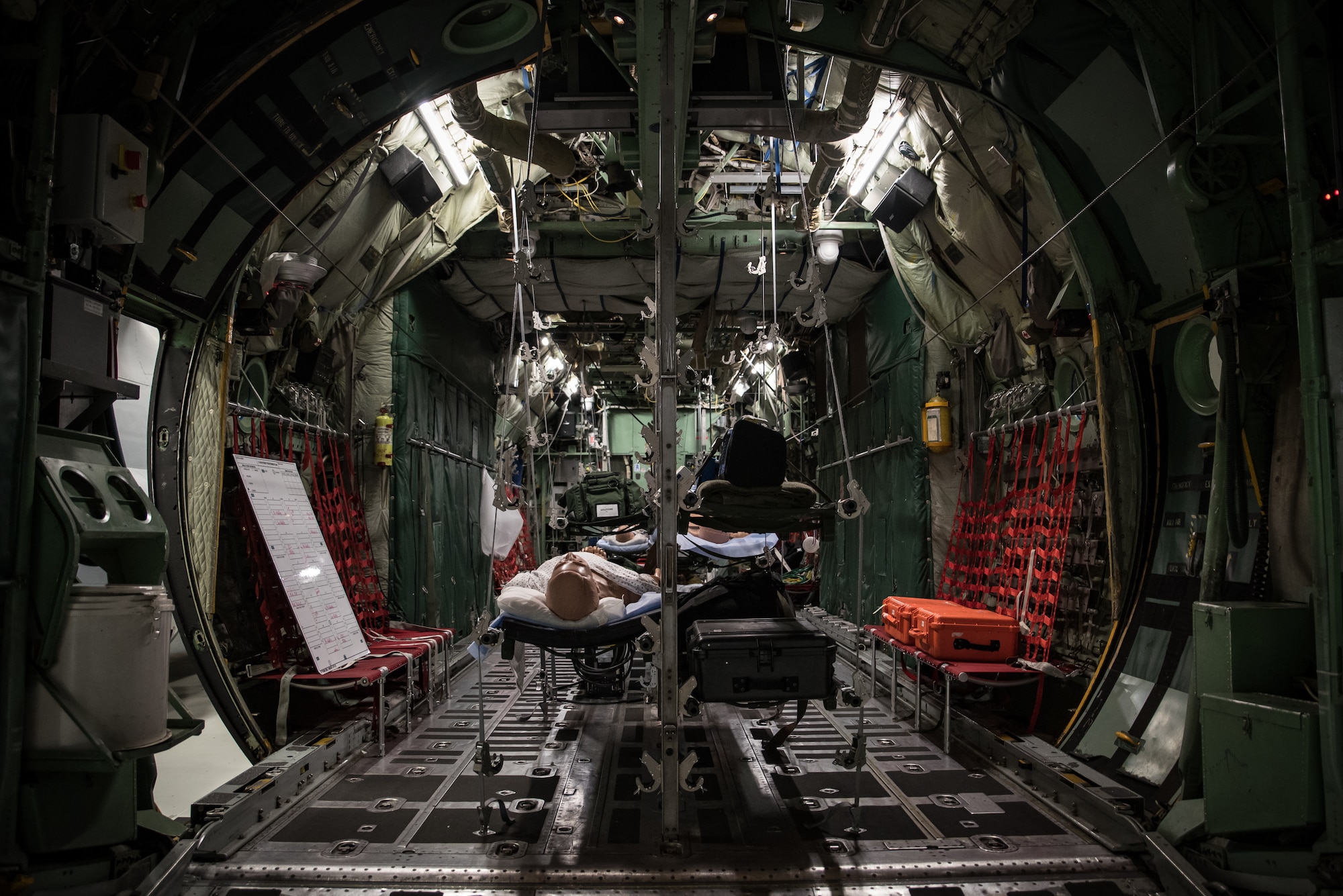 WRIGHT-PATTERSON AIR FORCE BASE (AFRL), Ohio – An aircraft simulator in the U.S. Air Force School of Aerospace Medicine, or USAFSAM, building displays a hospital inside an aircraft, ready to use by medical Airmen for aeromedical evacuation missions. USAFSAM is one of two mission units in the 711th Human Performance Wing, part of the Air Force Research Laboratory at Wright-Patterson Air Force Base, Ohio. The simulators are equipped with smoke, sound, fire, cameras and temperature changes, allowing the school to run realistic training.  (U.S. Air Force photo / Richard Eldridge)