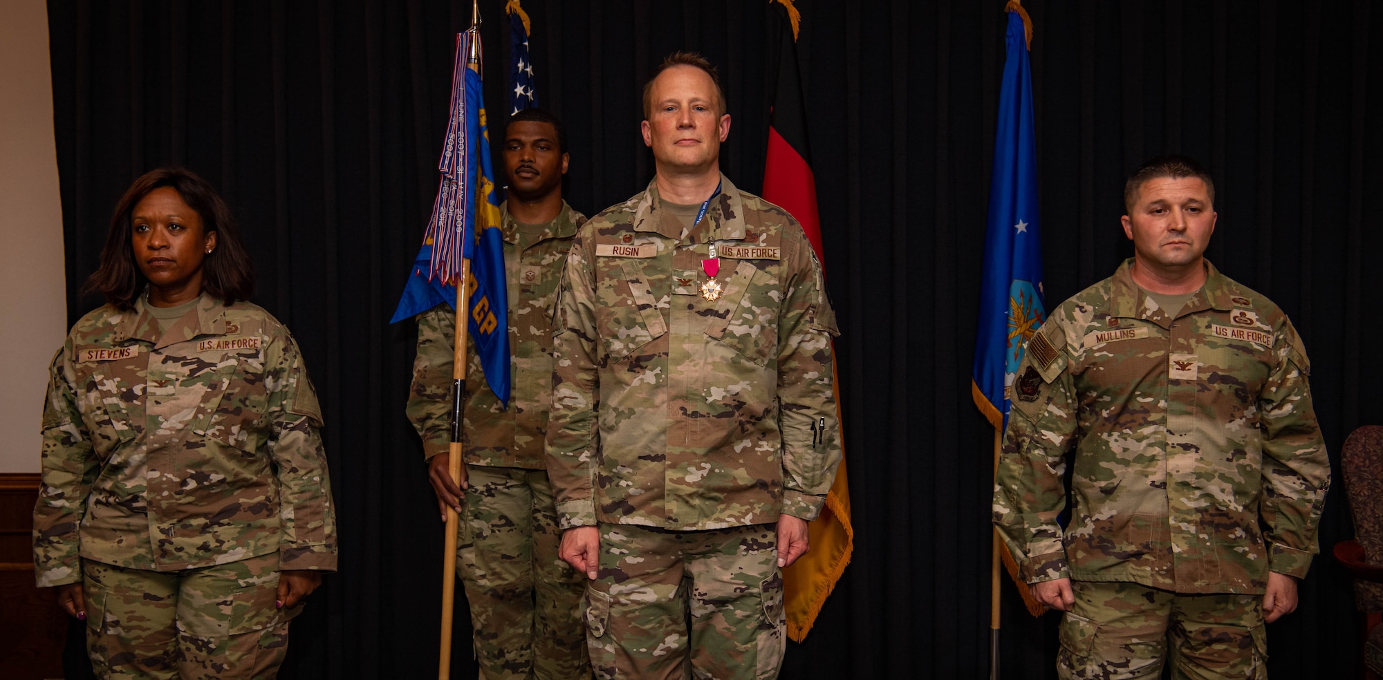 U.S. Air Force Col. Kayle Stevens, 480th Intelligence, Surveillance and Reconnaissance Wing commander (left), Col Nathan Rusin, 693rd ISR Group commander (center), and Col Creighton Mullins, military assistant to the Assistant Secretary of Defense for International Security Affairs (right), stand at attention during the 693rd ISRG change of command ceremony at Ramstein Air Base, Germany, May 6, 2022. The 693rd ISRG and its 3 subordinate squadrons conduct a variety of multi-intelligence operations, providing information to three combatant commands, combat forces and national leadership. (US Air Force photo by Airman 1st Class Jared Lovett)