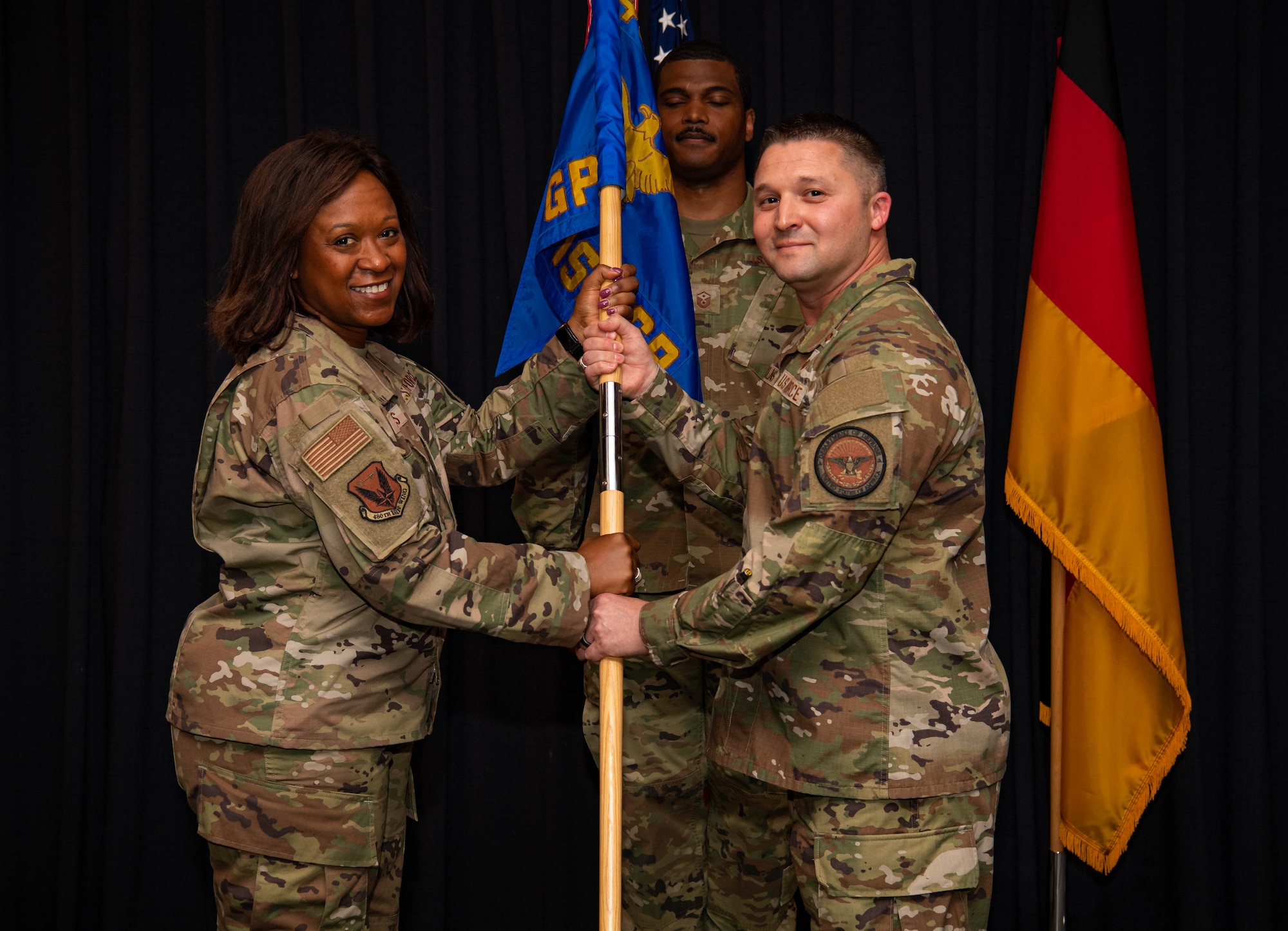 U.S. Air Force Col. Kayle Stevens, 480th Intelligence, Surveillance and Reconnaissance Wing commander (left), Col Creighton Mullins, 693rd ISR Group commander (right), pose for a photo during a change of command ceremony at Ramstein Air Base, Germany, May 6, 2022. Mullins assumed command of the group and its 900 Airmen, prepared to direct support of multiple combatant commands across a full range of military operations.