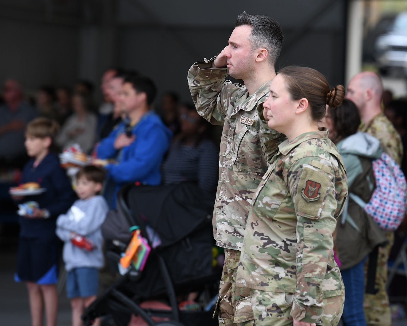 Airmen Salute During the National Anthem