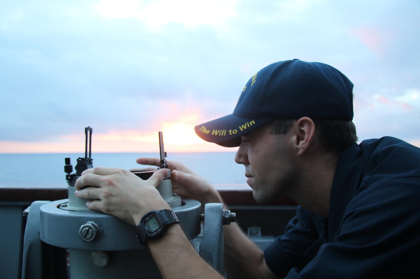 220510-N-NO824-1004 TAIWAN STRAIT (May 10, 2022) Ensign John Rodeheffer takes a bearing reading from the bridge wing of the Ticonderoga-class guided-missile cruiser USS Port Royal (CG 73) conducts a routine Taiwan Strait transit May 10. Port Royal is forward-deployed to the 7th Fleet area of operations in support of a free and open Indo-Pacific. (U.S. Navy photo by Ensign Jessika Stanback)