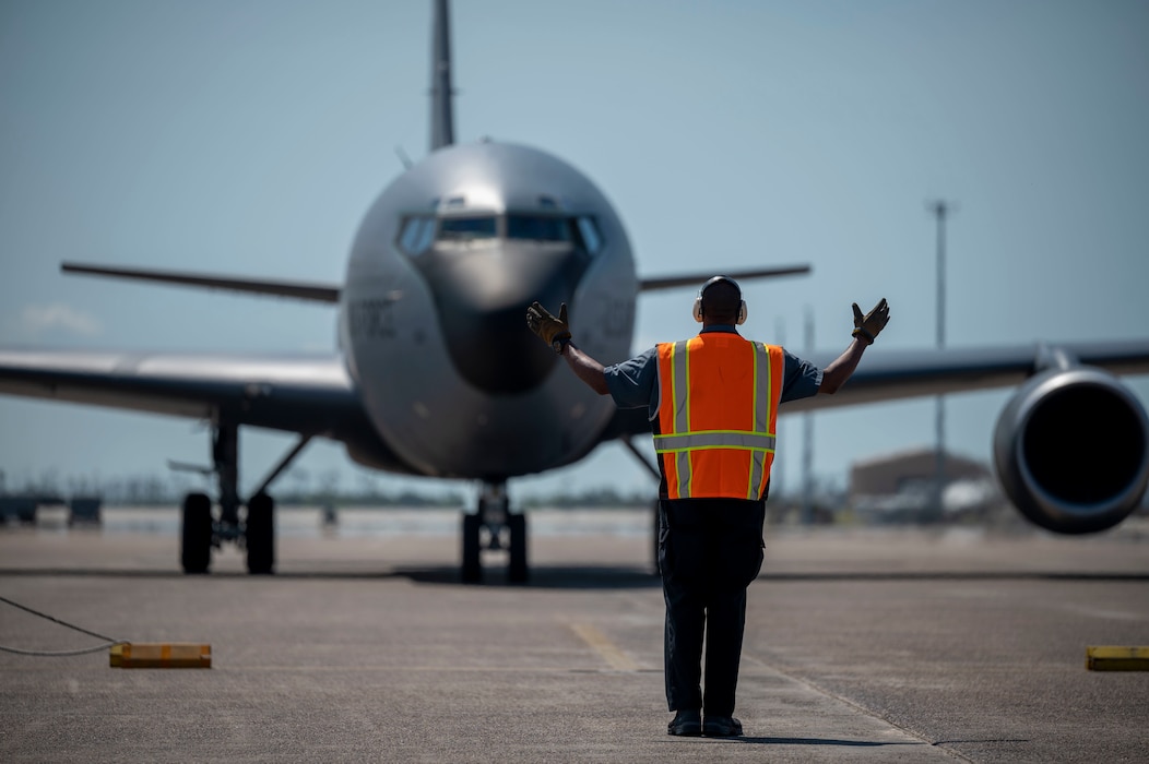 Man marshals a cargo plane