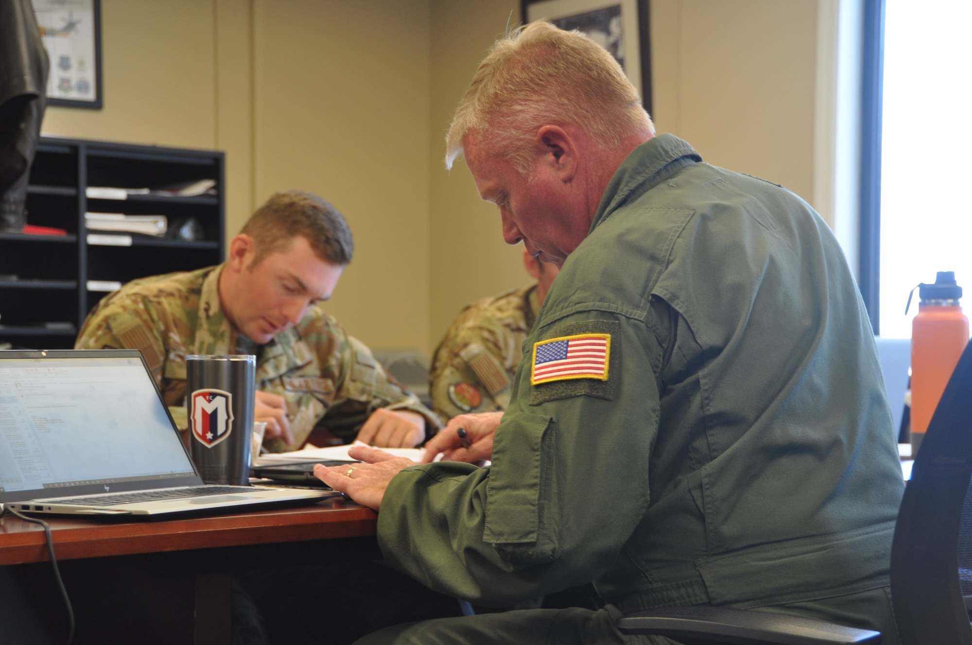 Members work on an class assignment