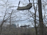 A CH-47 Chinook assigned to the New York Army National Guard’s Bravo Company, 3rd Battalion, 126th Aviation removes a 3,900-pound steel pontoon from the Niagara River just above the American side of Niagara Falls in Niagara Falls, New York on May 4, 2022. The pontoon, which washed away from an ice dam in 2019, was removed because of concerns that it could go over the falls and damage the “Cave of the Winds”.