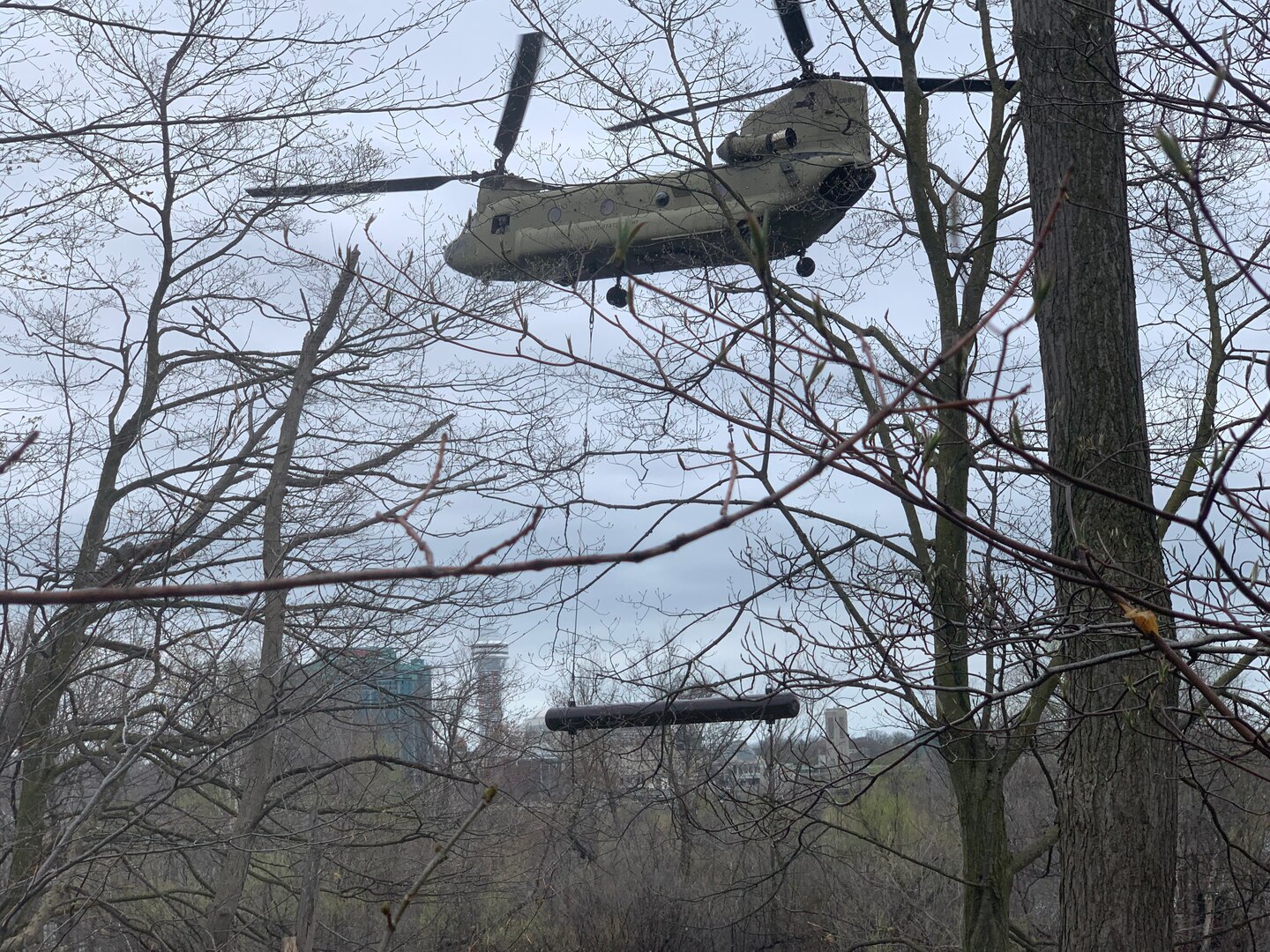 A CH-47 Chinook assigned to the New York Army National Guard’s Bravo Company, 3rd Battalion, 126th Aviation removes a 3,900-pound steel pontoon from the Niagara River just above the American side of Niagara Falls in Niagara Falls, New York on May 4, 2022. The pontoon, which washed away from an ice dam in 2019, was removed because of concerns that it could go over the falls and damage the “Cave of the Winds”.