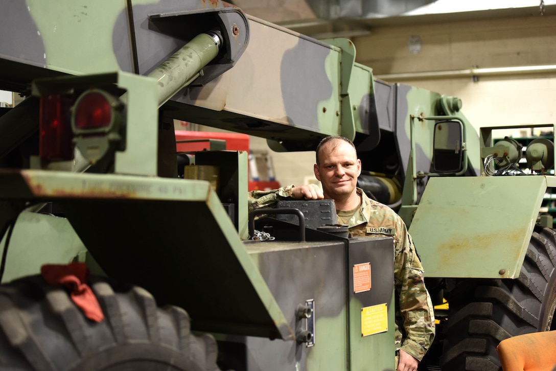 U.S. Army Warrant Officer Carl Merchant, wage leader, Michigan Army National Guard, who recently graduated from Warrant Officer Candidate School, poses for a photo at the Grand Valley Armory, Wyoming, Michigan, May 3, 2022. (U.S. Air National Guard photo by Master Sgt. David Eichaker)