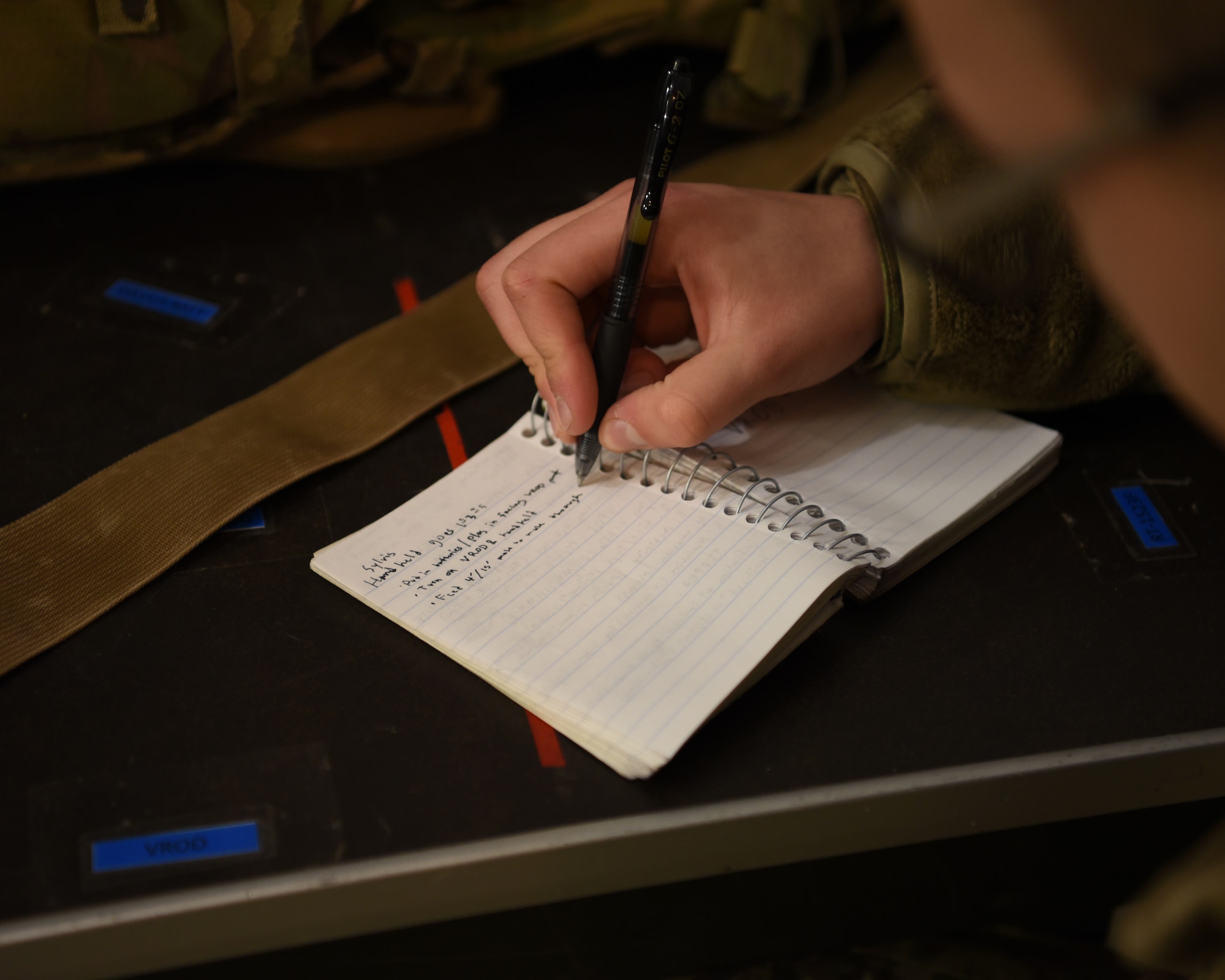 A U.S. Army student assigned to the 344th Military Intelligence Battalion, writes notes during the lecture portion of his joint capstone assessment at Goodfellow Air Force Base, Texas, Feb. 1, 2022. The student’s career field specializes in the analysis of foreign communications and finding intelligence activity. (U.S. Air Force photo by Senior Airman Abbey Rieves)