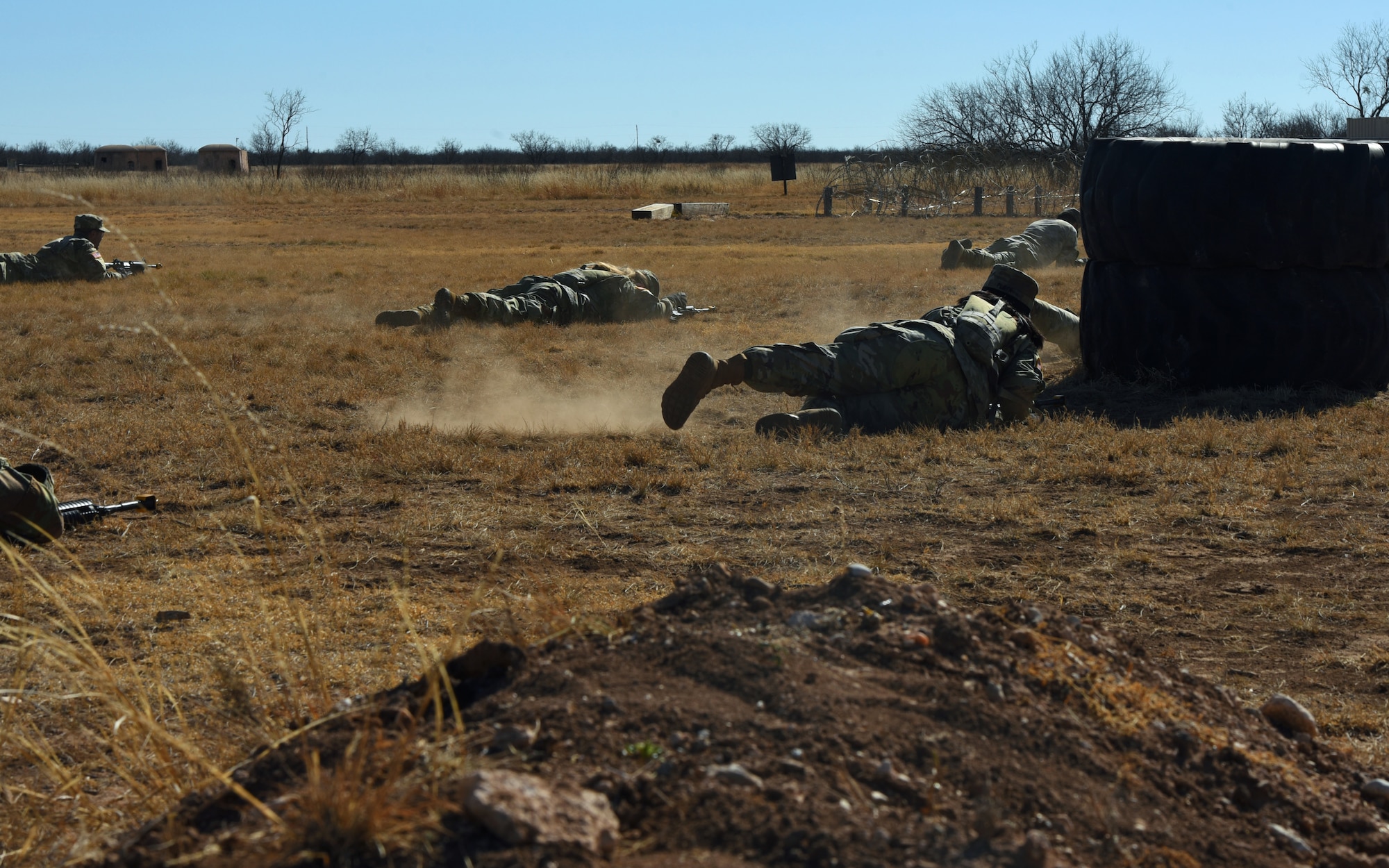 U.S. Army students assigned to the 344th Military Intelligence Battalion, take cover during a simulated adversary attack in their joint capstone assessment at Goodfellow Air Force Base, Texas, Feb. 1, 2022. The Tactical Signals Intelligence exercise was a five day, realistic evaluation that tests students’ collaboration efforts, strategic thinking, and their ability to collect, retain, and disseminate signals intelligence information. (U.S. Air Force Photo by Senior Airman Abbey Rieves)