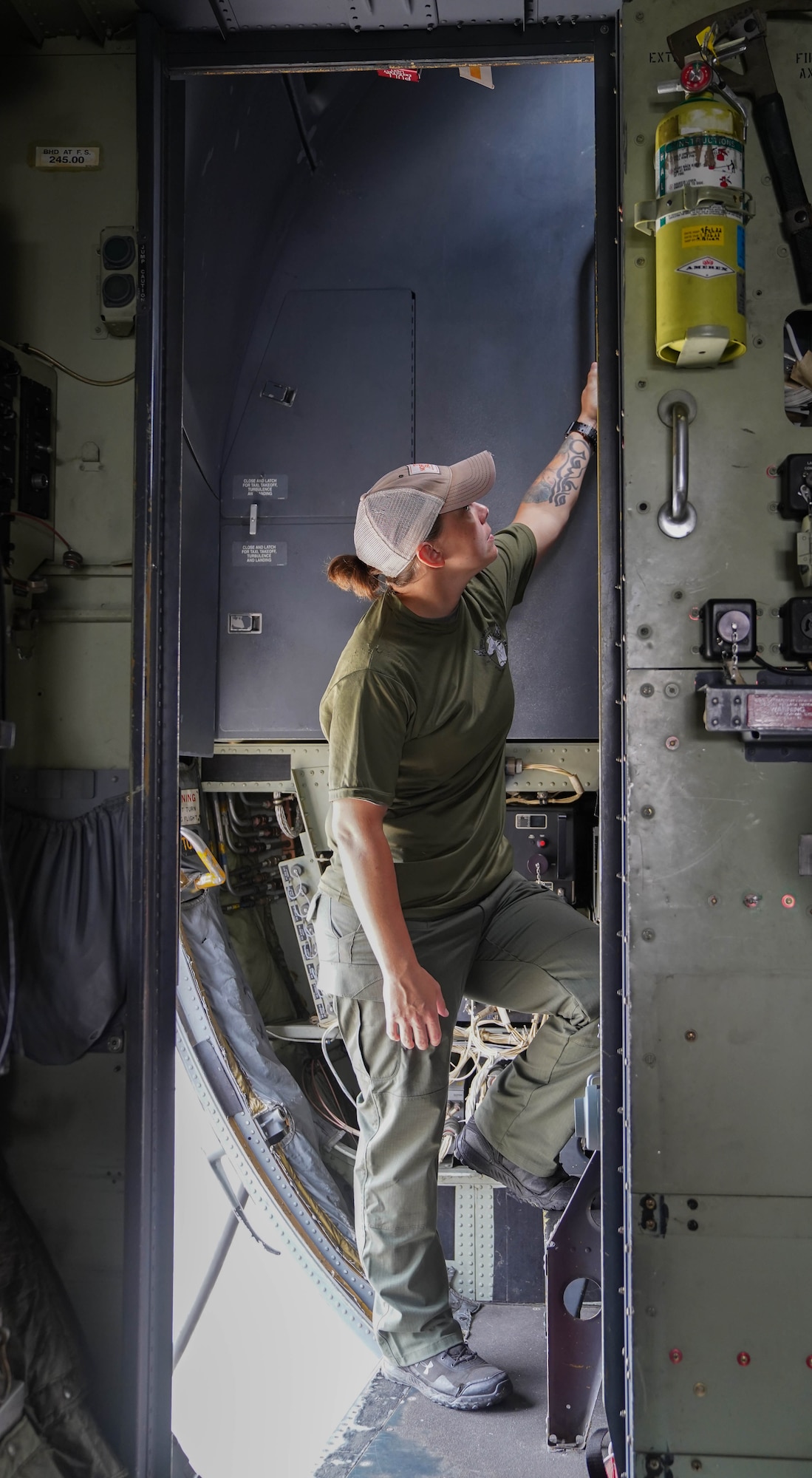 Chelsea Dean, Biloxi Special Weapons and Tactics officer, takes a tour of a C-130 during a joint training with the 81st Security Forces Squadron at Keesler Air Force Base, Mississippi, May 9, 2022. Security forces and Biloxi SWAT members trained together on aircraft anti-hijacking procedures.