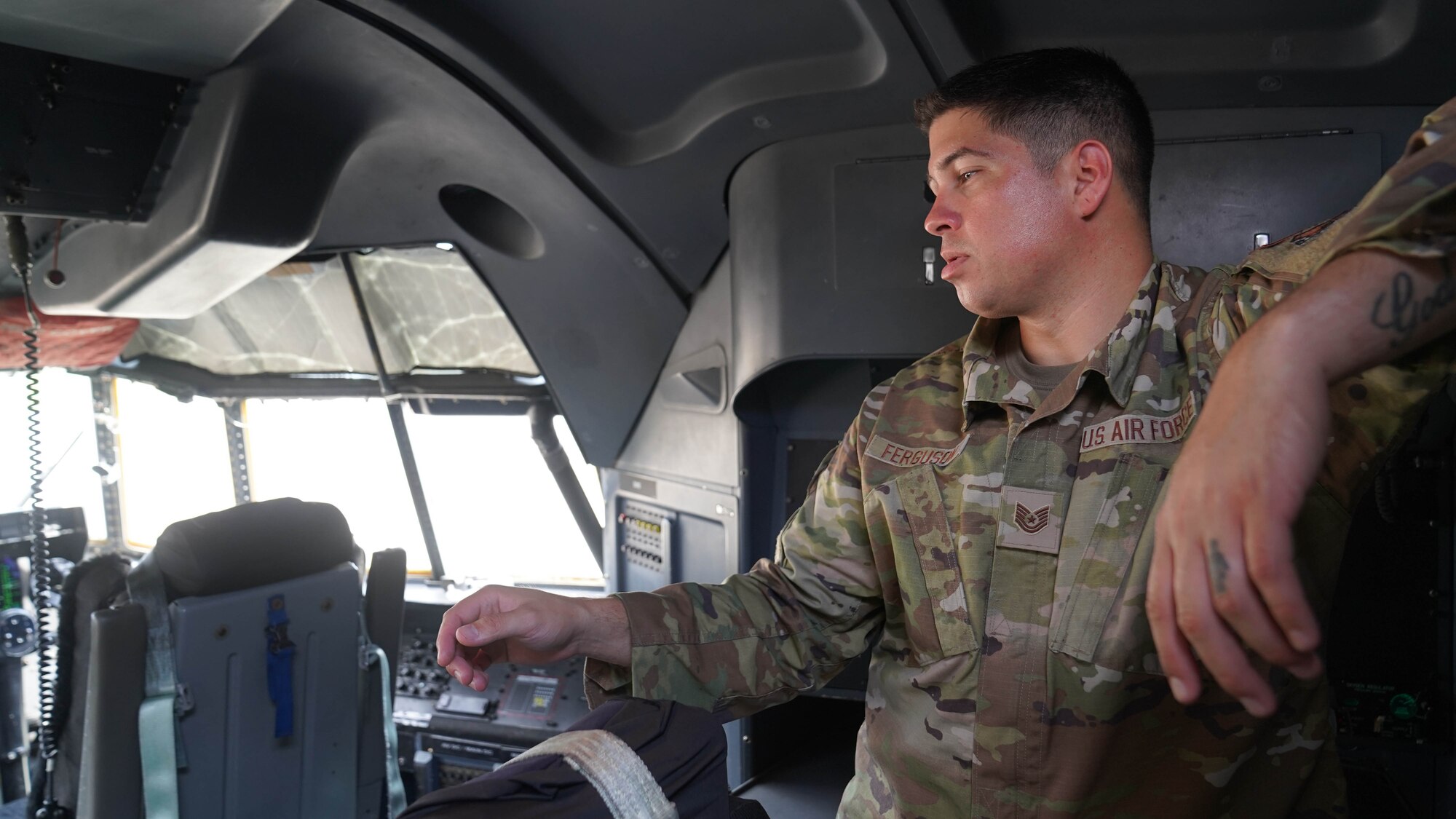 U.S. Air Force Tech Sgt. Charles Ferguson, 81st Security Forces Squadron unit training manager, tours the cockpit of a C-130 during a joint training with the Biloxi Special Weapons and Tactics team at Keesler Air Force Base, Mississippi, May 9, 2022. Security forces and Biloxi SWAT members trained together on aircraft anti-hijacking procedures.