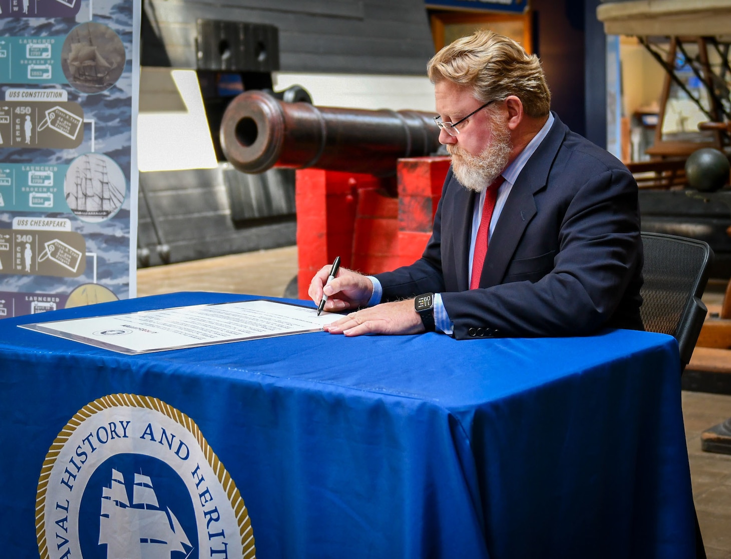 Patrick C. Burns, Deputy Director of Naval History and Heritage Command, signs a proclamation at the National Museum of the U.S. Navy, which proclaims May 10, 2022, to be U.S. Navy Original Six Frigates Day.