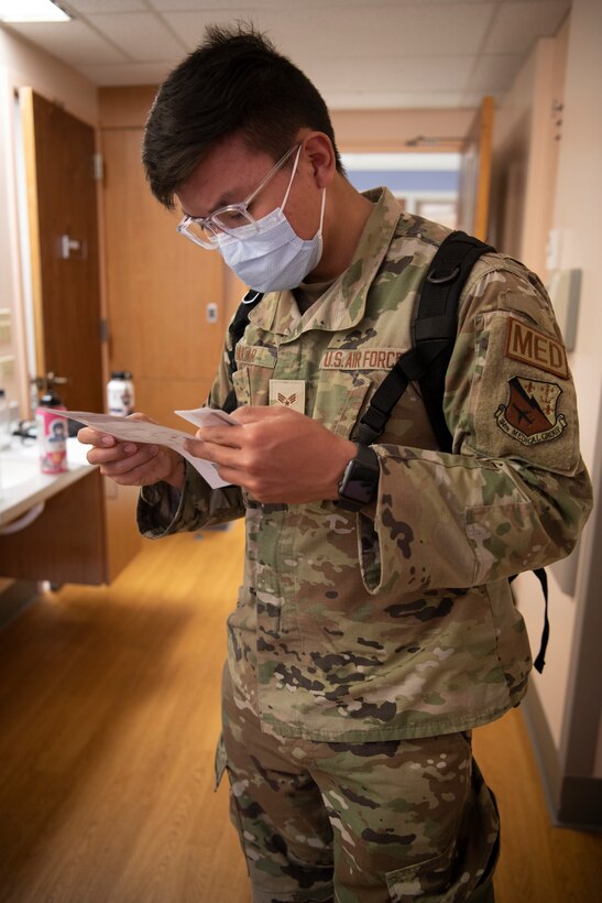 Senior Airman Tenzin Dakar, 104th Medical Group aerospace medical technician, looks over a spreadsheet during a training exercise at Tripler Army Medical Center, Hawaii, April 28, 2022. Dakar is at Tripler to provide medical support and complete training requirements. (U.S. Air National Guard photo by 1Lt. Amelia Leonard)