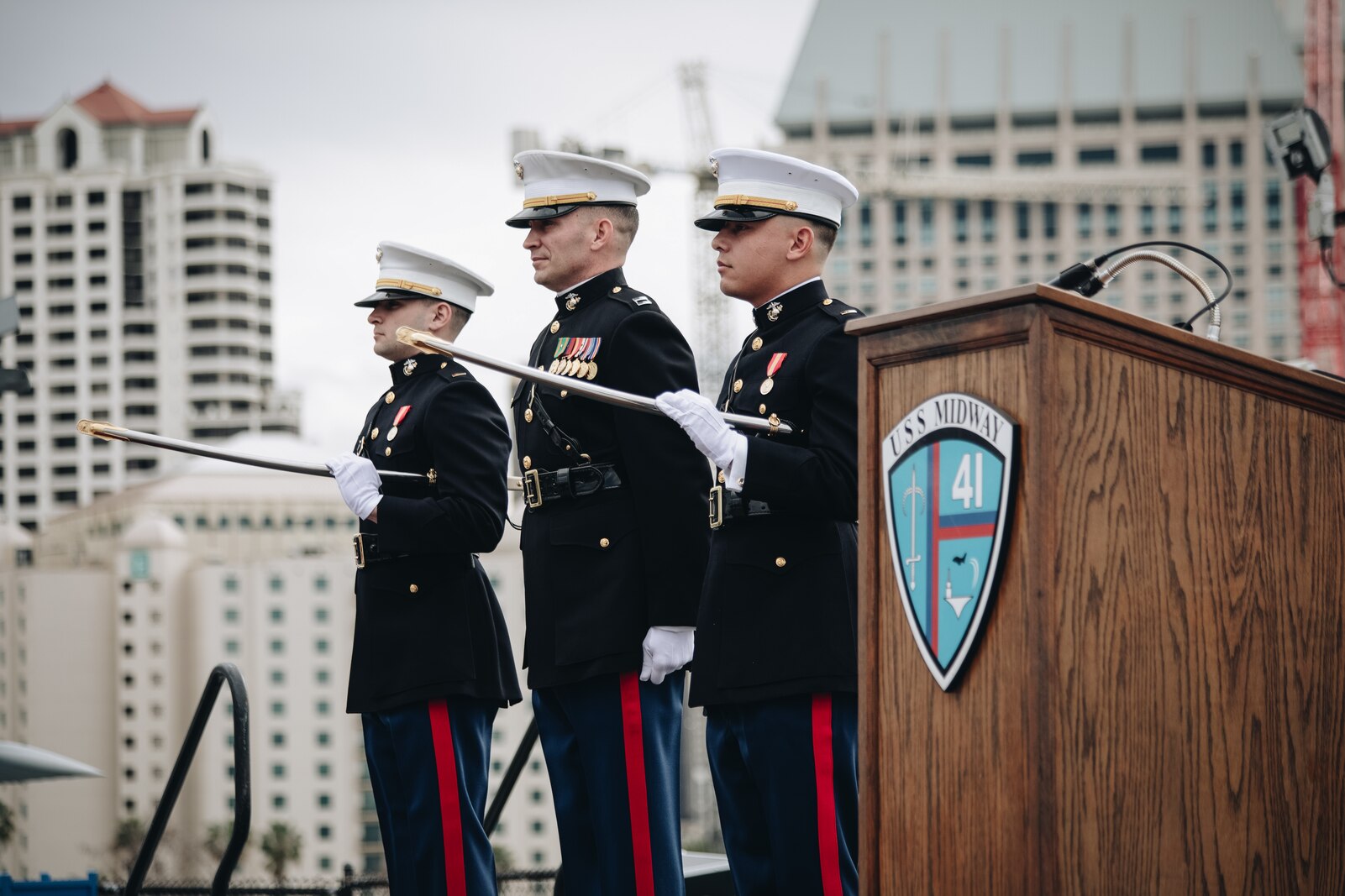 U.S. Marine Corps officers stand at attention on the flight deck of the USS Midway during a commissioning ceremony in San Diego, California, Jan. 29, 2022. A commissioning ceremony is the culminating event of an officer’s career, signifying the transformation from candidate to officer. (U.S. Marine Corps photo by Sgt. Alina Thackray)
