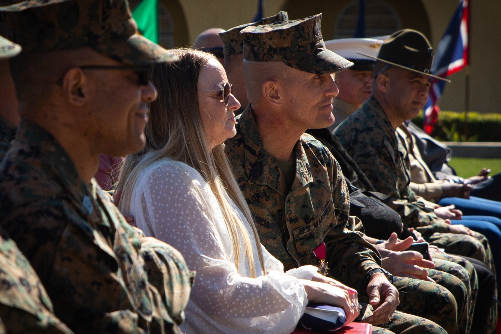 U.S. Marine Corps Sgt. Maj. Carlos M. Murcia, the outgoing sergeant major for 12th Marine Corps District, listens to the Col. James B. Conway, the commanding officer for 12th Marine Corps Dirstrict, during a relief and appointment ceremony at Marine Corps Recruit Depot, San Diego, California on Feb. 25, 2022. Murcia retired after 30 years of honorable service. (U.S. Marine Corps photo by Cpl. Emely Gonzalez)