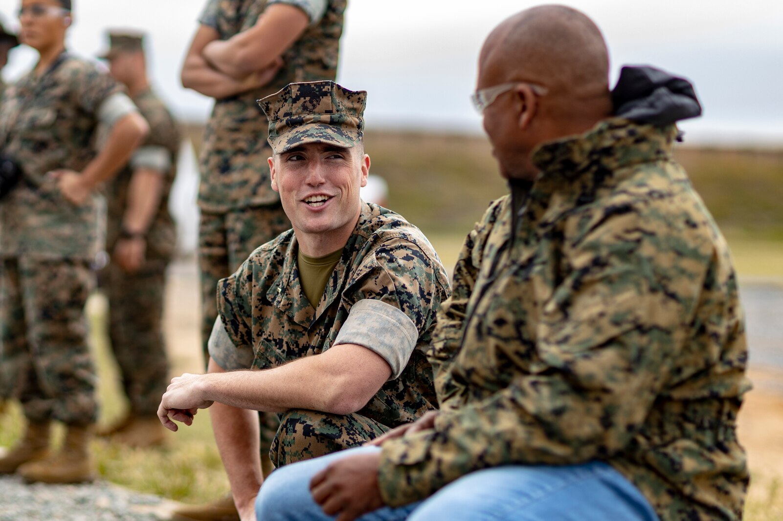 U.S. Marine Corps 2nd Lt. Steven Hunt, the assistant marketing and communications officer for 12th Marine Corps District, speaks with an educator during the U.S. Marine Corps Educators' Workshop at Edson Range, Marine Corps Base Camp Pendleton, California on March 31, 2022. The Educators' Workshop is a five-day program designed to better inform teachers, coaches, counselors and influencers about the benefits and opportunities available during service in the Marine Corps. This allows attendees to return home and provide firsthand experience and knowledge to individuals interested in military service. (U.S. Marine Corps photo by Staff Sgt. Kelsey Dornfeld)