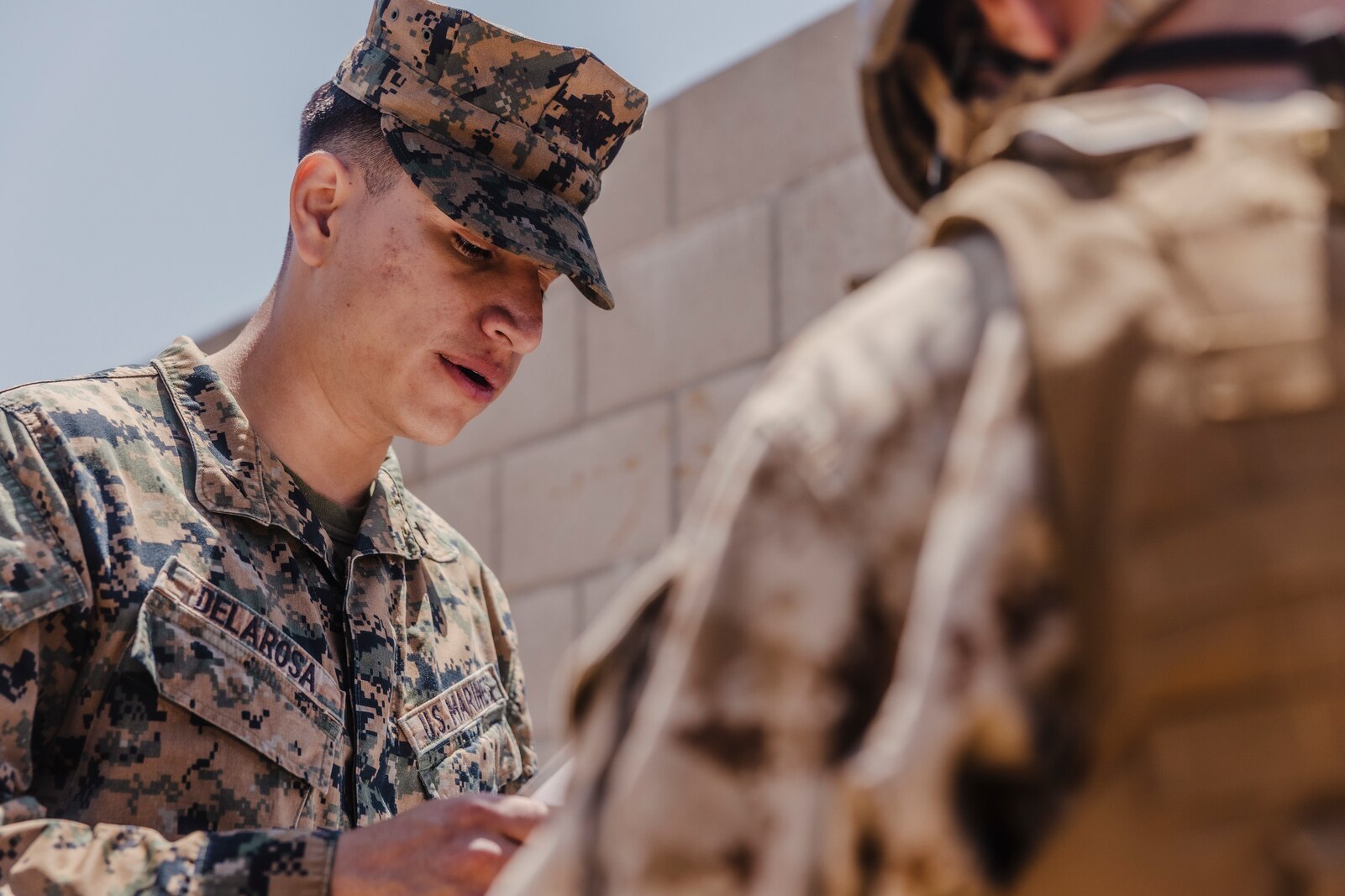 U.S. Marine Corps Lance Cpl. Kevin Delarosa, an administrative specialist with 12th Marine Corps District, gives instructions to a candidate with Officer Selection Team San Diego, during the leadership reaction course at an Officer Candidates School preparation weekend, Camp Pendleton, California on April 30, 2022. The OCS preparation weekend is designed to prepare aspiring Marine Corps officers mentally and physically for the rigors of OCS. (U.S. Marine Corps photo by Staff Sgt. Kelsey Dornfeld)