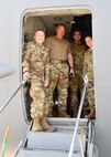 1st Lt. Vinny Zotto, 104 MDG supervisor, Master Sgt. Michael Hoar, 104th Fighter Wing first sergeant., Tech. Sgt. Austin Von Richthofen, 104 MDG aerospace medical technician and Capt. Krista Campbell, 104 MDG nurse stand in the doorway of a C-17 Globemaster III during refueling at Travis Air Force Base, California, April 23, 2022. These members are traveling to Tripler Army Medical Center in Honolulu, Hawaii to complete training requirements. (U.S. Air National Guard Photo by Senior Airman Camille Lienau)