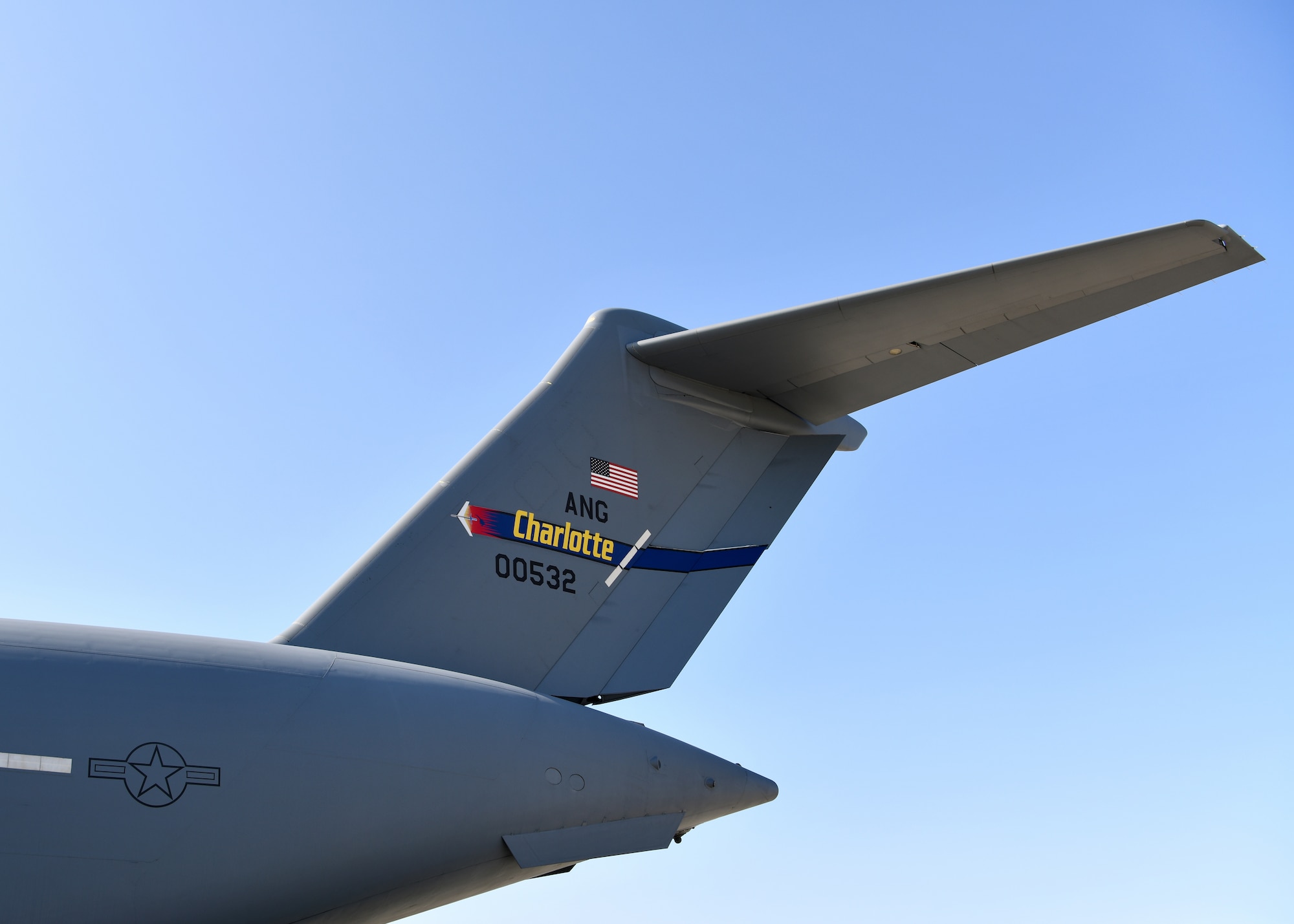 A C-17 Globemaster III from the 145th Airlift Wing in Charlotte, North Carolina waits on the flightline to be refueled at Travis Air Force Base, California, April 23, 2022. Tail codes identify the aircraft's unit or base assignment and were first introduced during WW2 on aircraft carriers for the U.S. Navy. (U.S. Air National Guard Photo by Senior Airman Camille Lienau)