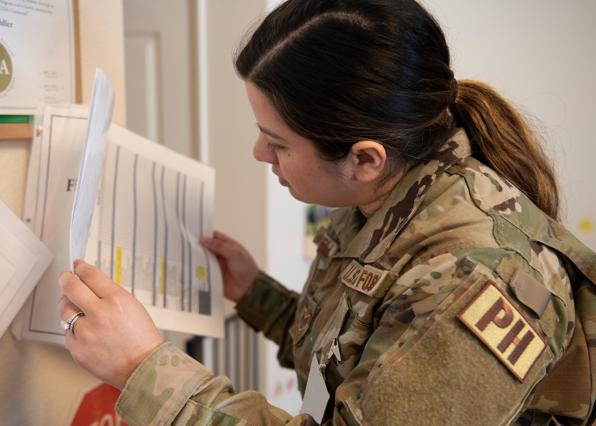 Staff Sgt. Wesley Powell, 104th Medical Group public health technician and facility manager, looks over a document during training at Tripler Army Medical Center, Hawaii, May 3, 2022. Powell is at Tripler to provide medical support and complete training requirements (U.S. Air National Guard Photo by 1Lt. Amelia Leonard).