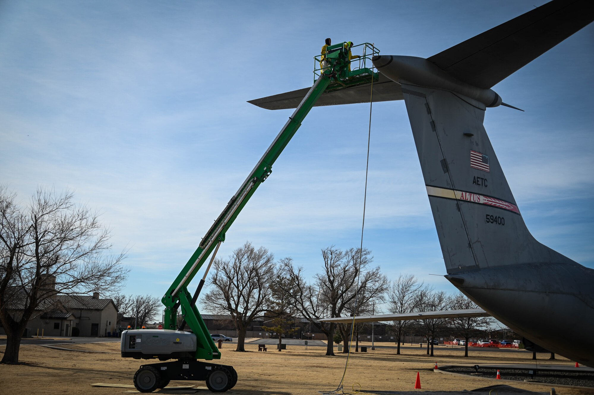 Two technicians wash a static C-141 Starlifter at Altus Air Force Base, Oklahoma, Feb. 15, 2022. Historians and historical property custodians are responsible for preserving and protecting the history, heritage, and culture of the Air Force through collections, exhibits, and displays. (U.S. Air Force photo by Senior Airman Kayla Christenson)