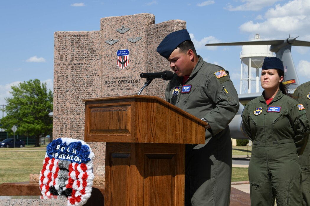 U.S. Air Force Staff Sgt. Christian Bande, 54th Air Refueling Squadron boom operator instructor, speaks at the 97th Air Mobility Wing’s 42nd Annual Boom Symposium memorial ceremony at Altus Air Force Base, Oklahoma, April 29, 2022. During the ceremony, narrators read the names of boom operators who have died in the line of duty. (U.S. Air Force photo by Airman 1st Class Trenton Jancze)