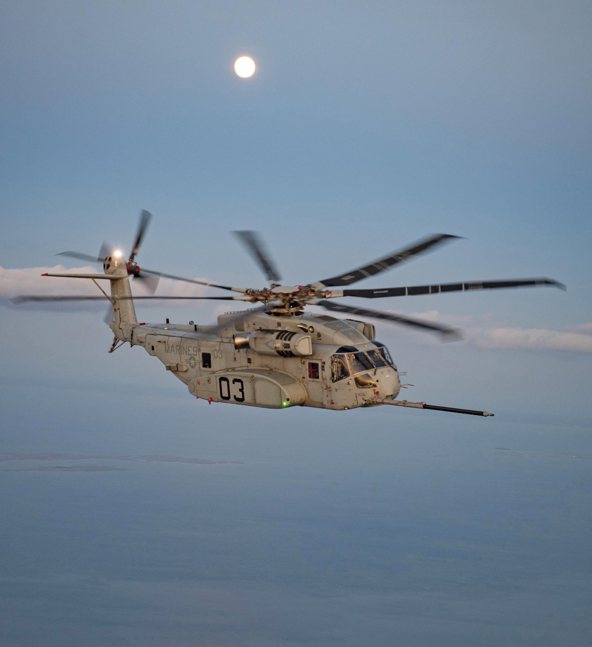 A CH-53K King Stallion aircraft undergoes night aerial refueling tests over the Chesapeake Bay in June, 2021.