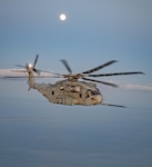 A CH-53K King Stallion aircraft undergoes night aerial refueling tests over the Chesapeake Bay in June, 2021.