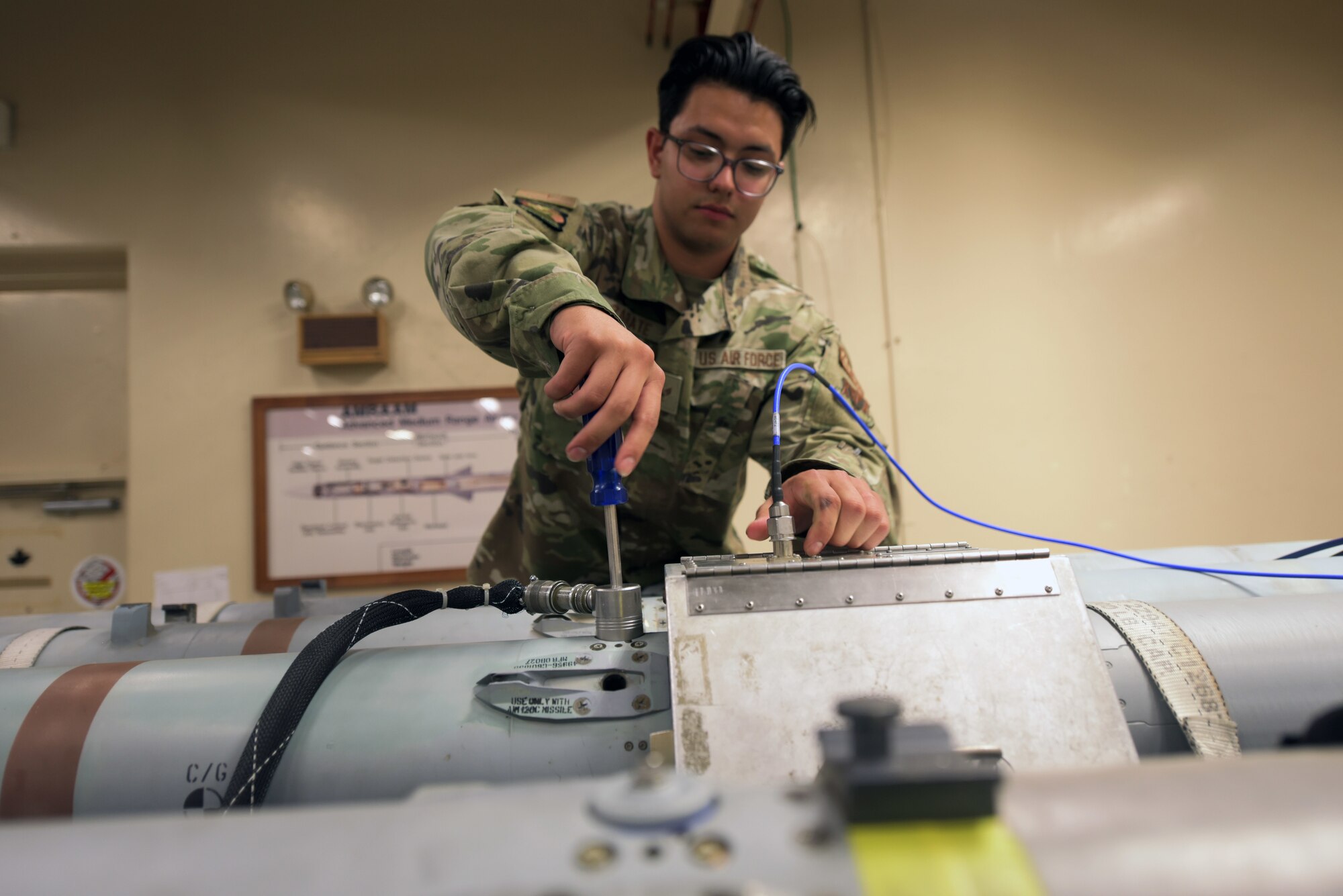Airman works on missiles