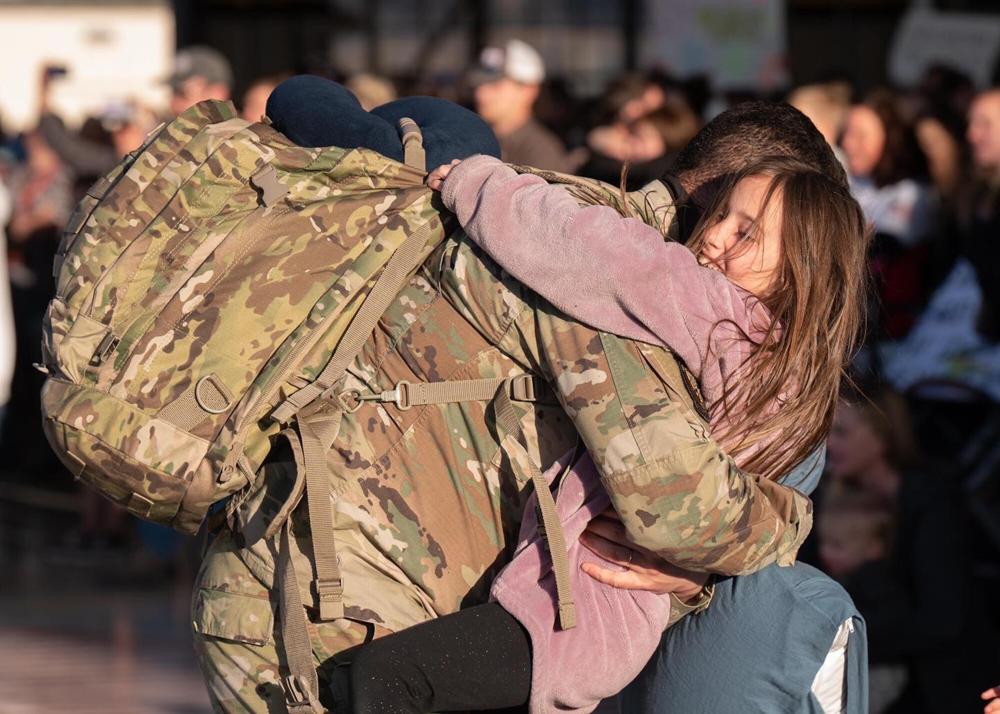 Family members greet Airmen after a deployment.