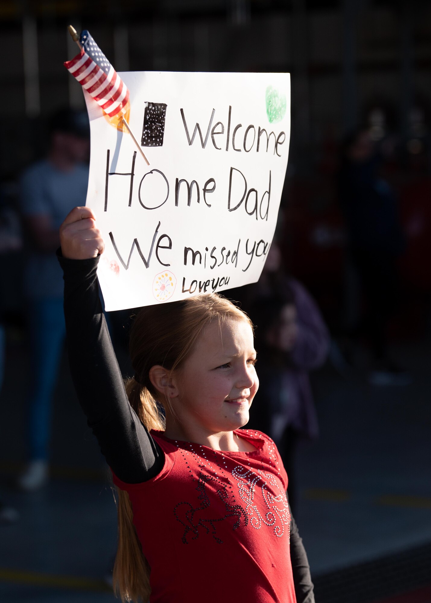 Family members greet Airmen after a deployment.