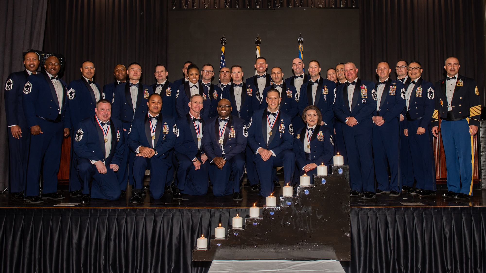 Chief Master Sergeants and selects from various groups and squadrons pose for a photo at the U.S. Air Force Chief Recognition Ceremony