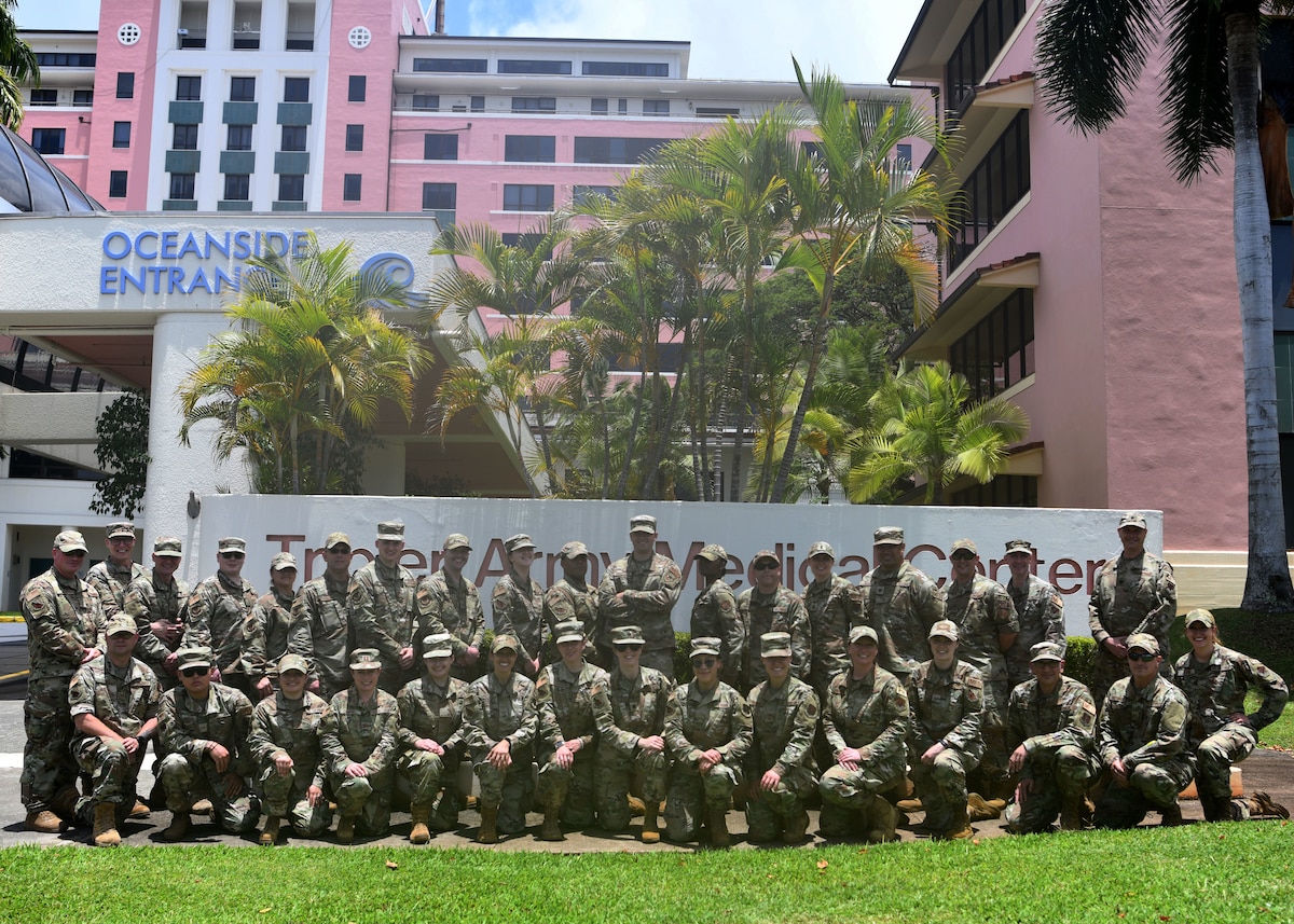 Members from the 104th Fighter Wing Medical Group pose for a group photo during their Medical Field Annual Training at Tripler Army Medical Center, Honolulu, Hawaii, May 3, 2022. This training allowed 104MDG members the opportunity to train in and provide support to an active-duty military hospital. (U.S. Air National Guard Photo by Senior Airman Camille Lienau)