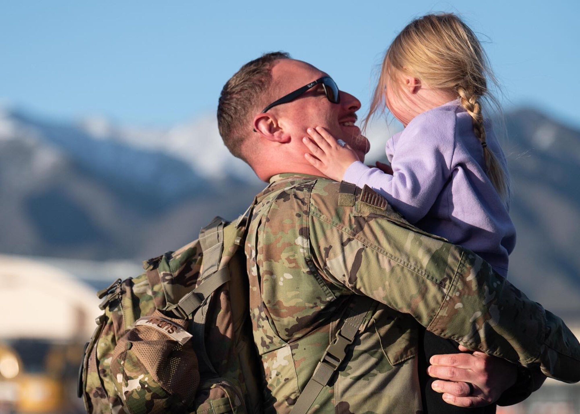 Family members greet Airmen after a deployment.