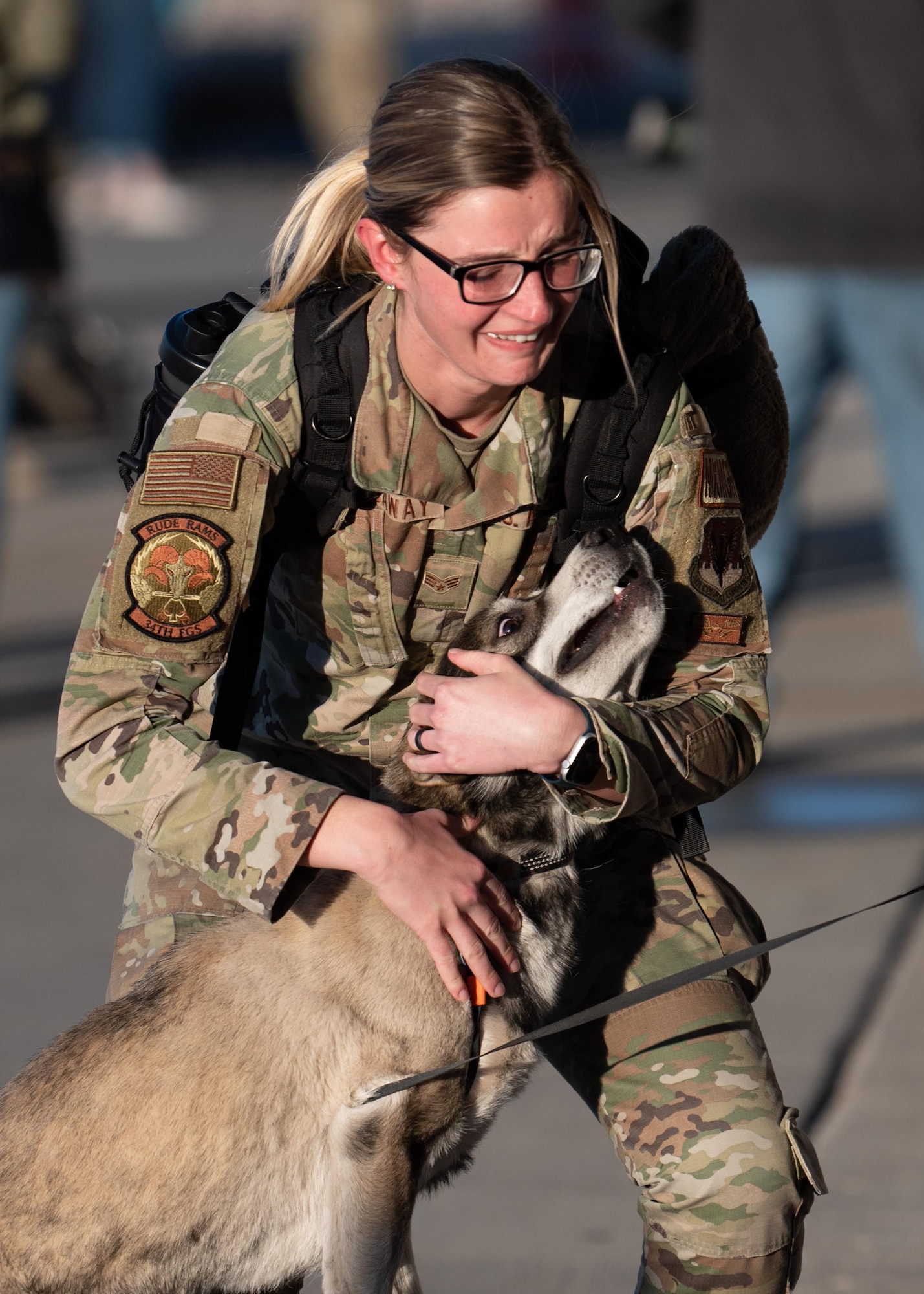 Family members greet Airmen after a deployment.