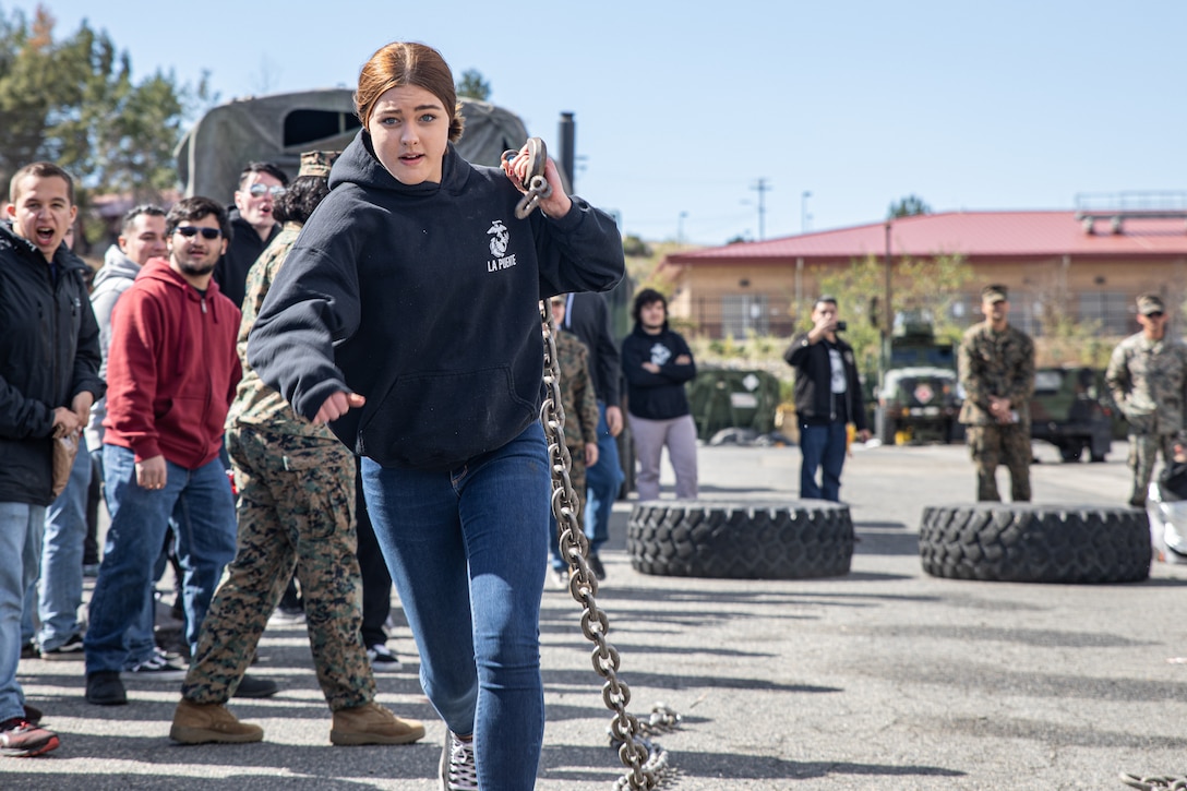 A future U.S. Marine with Recruiting Sub-Station Corona, Recruiting Station Riverside, runs with a chain during a pool function aboard Marine Corps Base Camp Pendleton, California, Feb. 23, 2022. The pool function is an opportunity for future Marines to build commaraderie and strengthen their commitment to the Marine Corps. (U.S. Marine Corps photo by Sgt. Ana S. Madrigal)