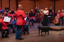 On May 8, 2022, guest soloist Mimi Stillman performed with the Marine Chamber Orchestra at the Rachel M. Schlesinger Concert Hall and Arts Center in Alexandria, Va. During the concert, she gave the world premiere of Concerto for Flute and Orchestra by composer Zhou Tian. As shown, Stillman performs an encore with Percussionist Master Sgt. Glen Paulson.
