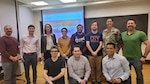 Washington University Graduate Students and staff that participanted in the Hacking for Defense project, pose with Missouri Army National Guard Maj. Dori McClelland.