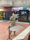 Woman in Uniform speaking