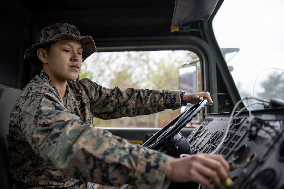 U.S. Marine Corps Lance Cpl. Tayiva King, a motor vehicle operator with Combat Logistics Battalion 4, Combat Logistics Regiment 3, 3rd Marine Logistics Group, prepares for a convoy during Mission Rehearsal Littoral Exercise 2022 at Combined Arms Training Center, Camp Fuji, Japan, May 8, 2022. The purpose of the MRLEX was to conduct an airfield survey of an existing aircraft landing zone for infrastructure improvement, runway repair and preparation of potential forward arming and refueling points, as well as progress integration initiatives with our Japanese allies while advancing III Marine Expeditionary Force’s and Marine Corps Installations Pacific’s goals tied to agile combat employment, expeditionary advanced base operations, and humanitarian assistance disaster relief.