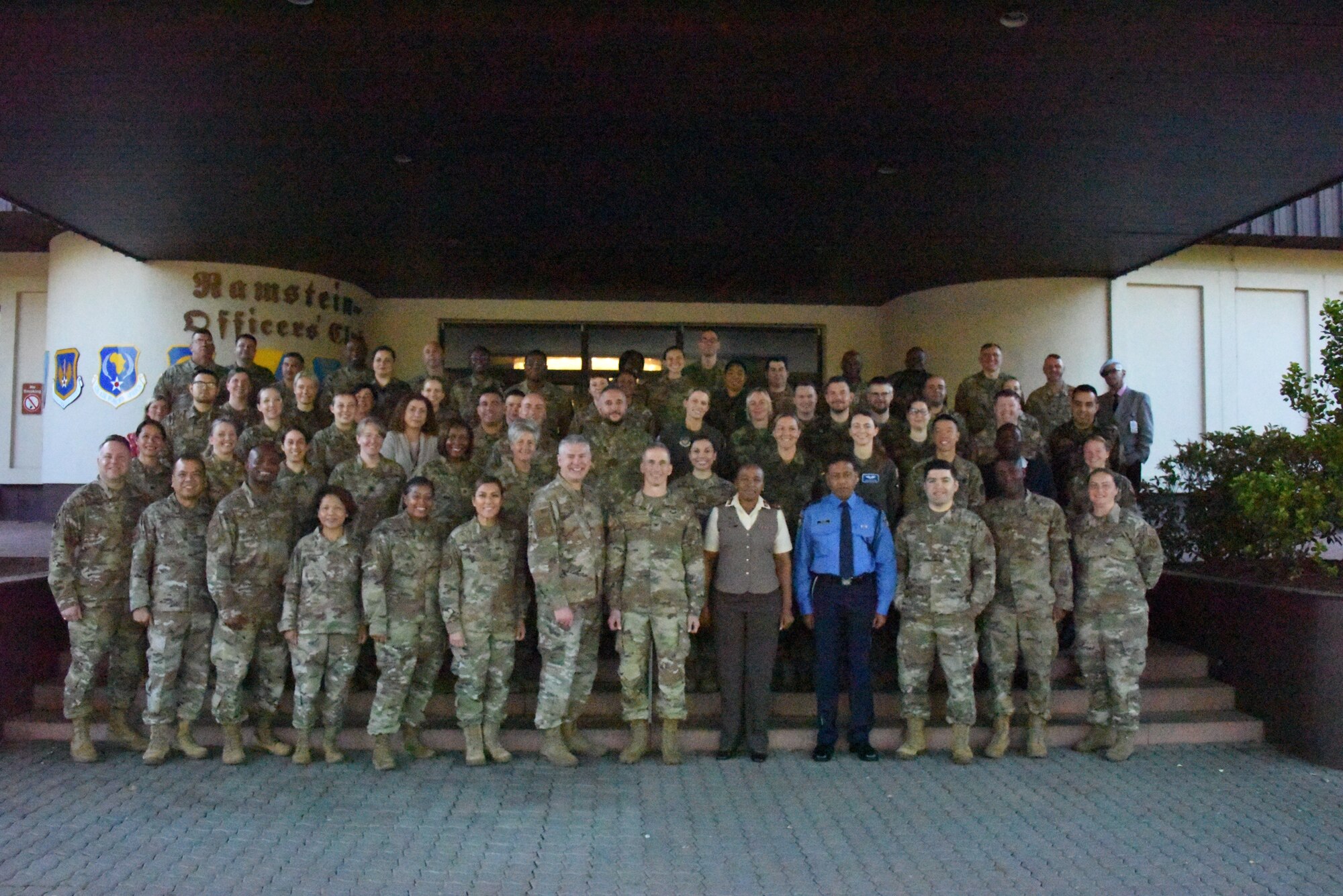 Airmen, Soldiers, and foreign delegates from Botswana, Czech Republic, Estonia, Germany, Mauritius, Morocco, Nigeria, North Macedonia, Romania, Slovenia, South Africa, and Tanzania pose for a group picture during U.S. Air Forces in Europe - Air Forces Africa’s European-African Military Nursing Exchange conference at Ramstein Air Base, Germany, May 9, 2022.